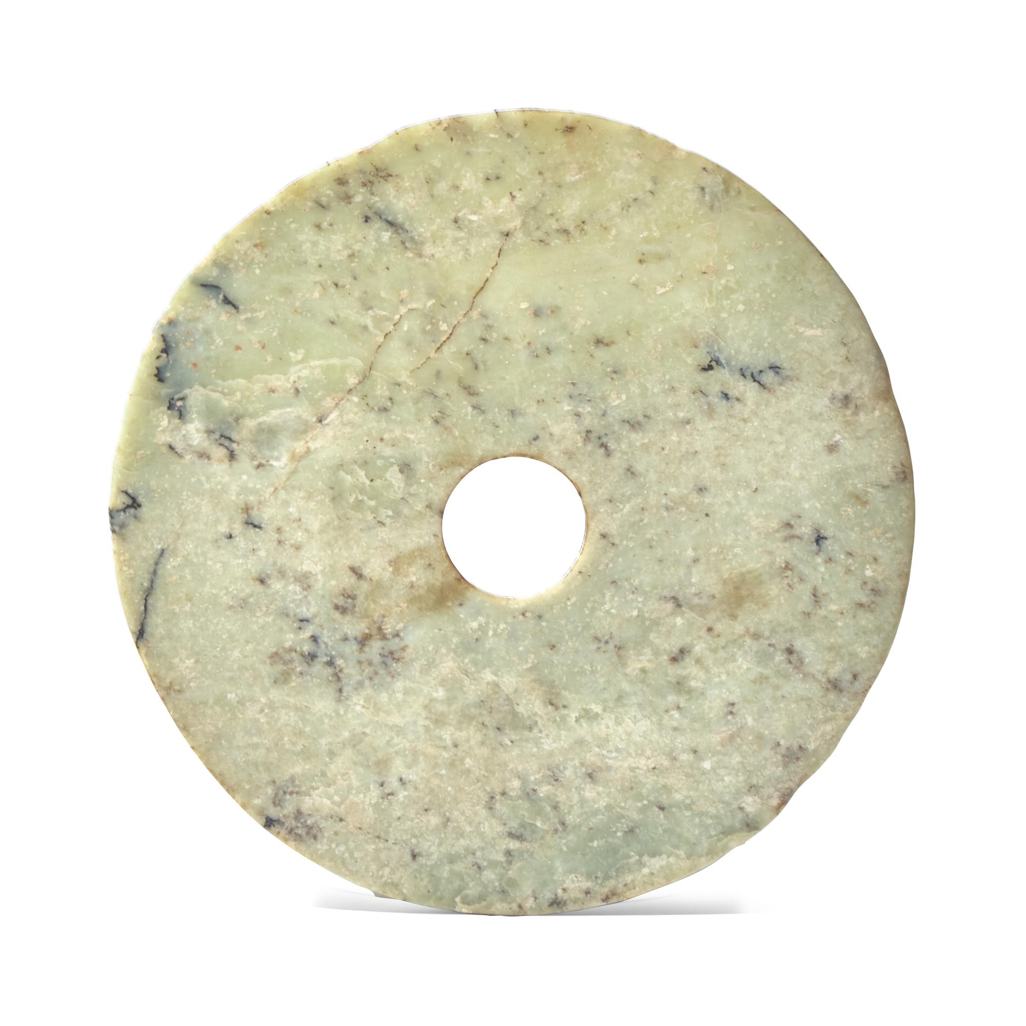 A Chinese Archaistic Mottled Pale Green Jade Bi Disc