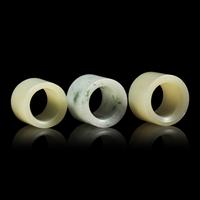 A Group of Three Chinese Jade and Jadeite Archer's Rings 翡翠及玉扳指一組三件