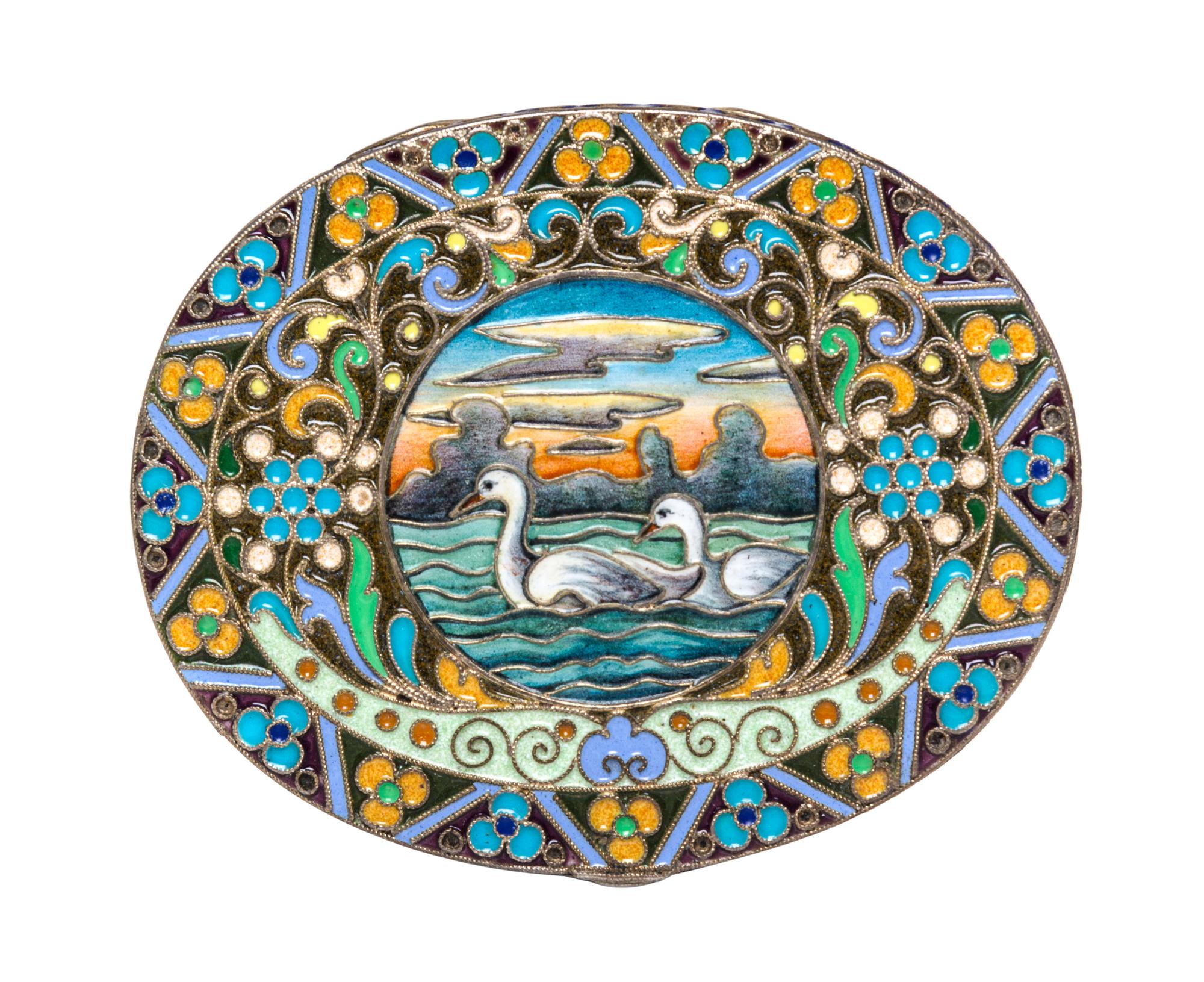 A Russian Enameled Gilt-Silver Box, possibly Bernhard Hinds, Moscow, 1908-1926, of oval form, the lid centered with two swans within a