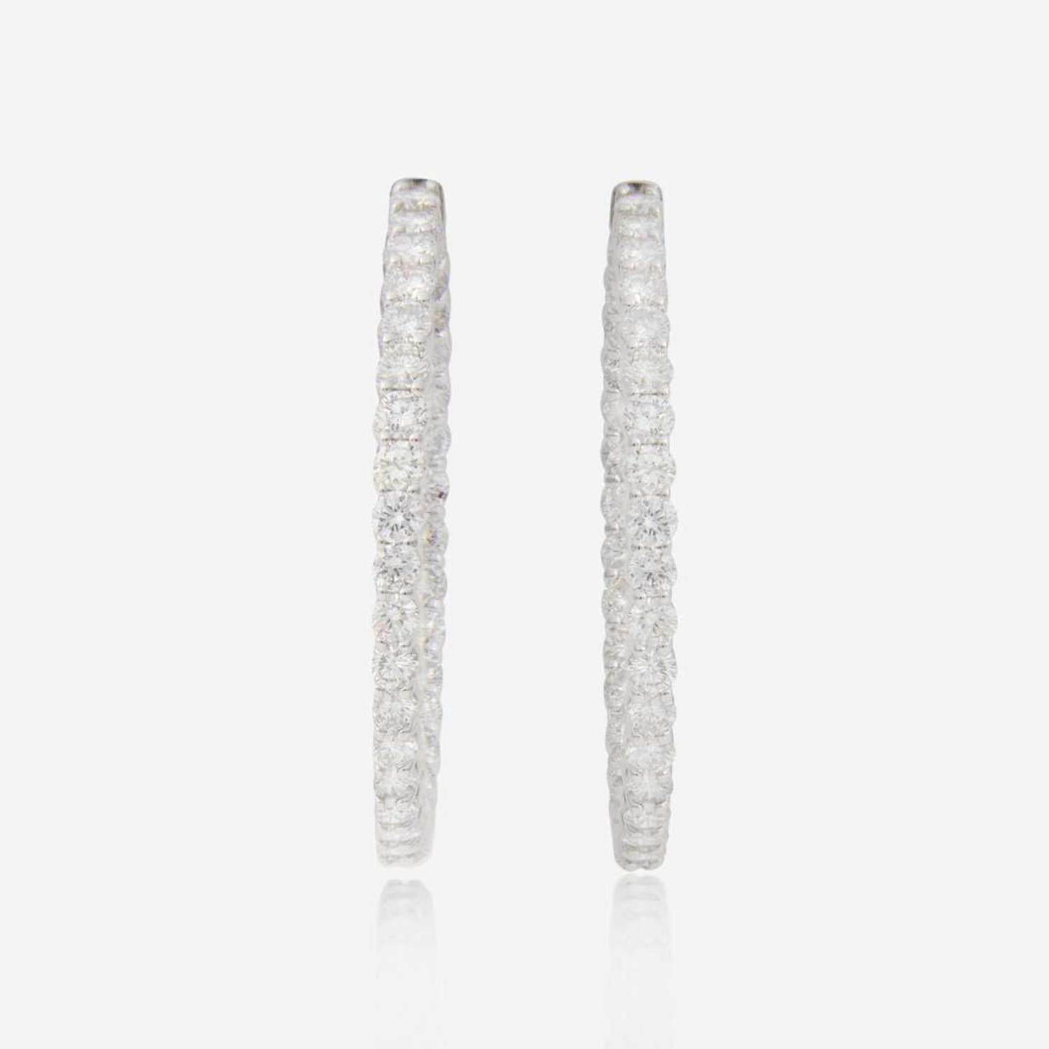 A Pair of Diamond and 14K White Gold Earrings