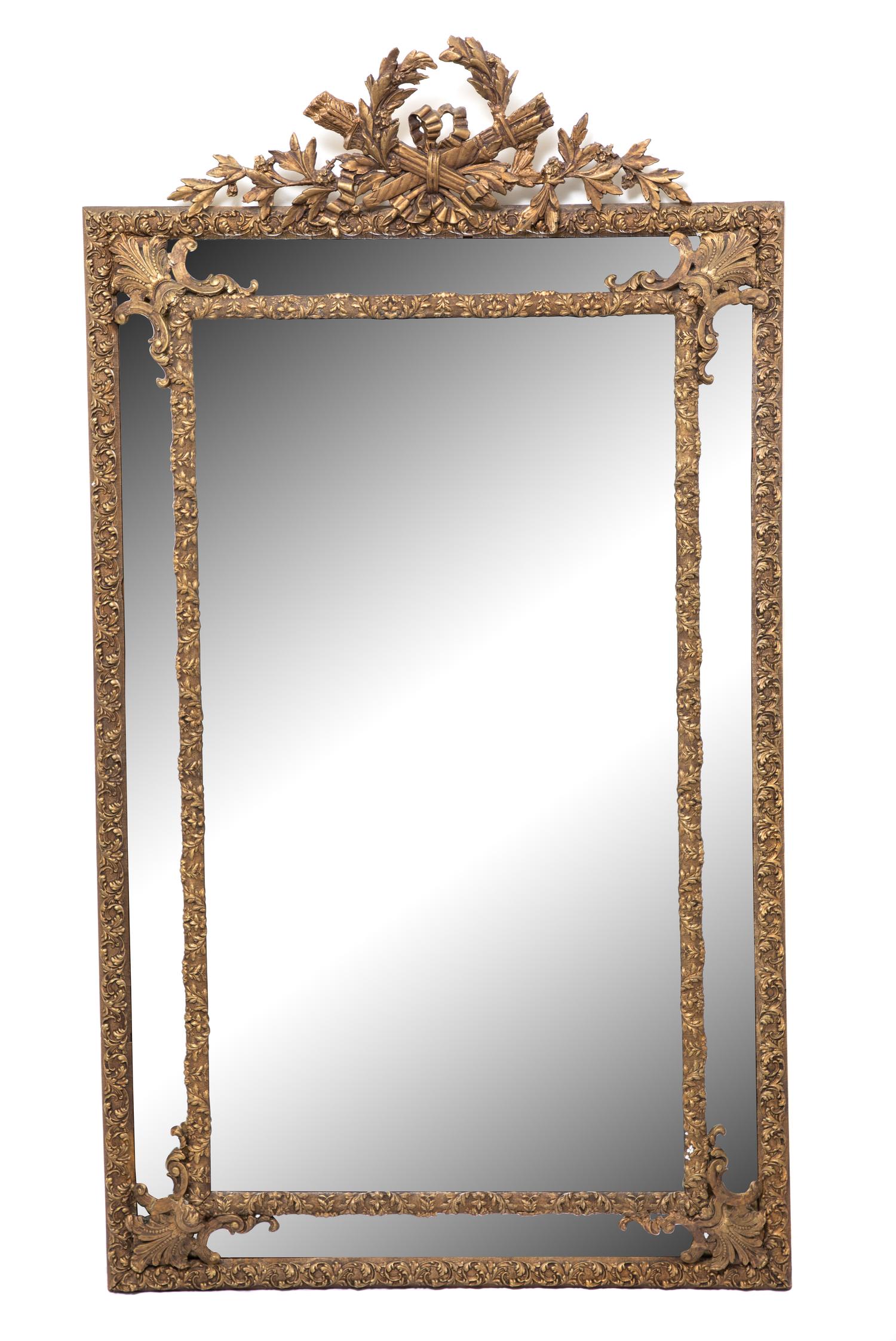 A Louis XVI Style Giltwood Cushion Mirror Height 66 x width 37 inches.