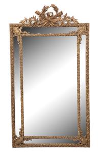 A Louis XVI Style Giltwood Cushion Mirror Height 66 x width 37 inches.