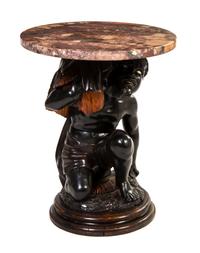 A Venetian Carved Figural Pedestal, Height 21 1/4 x diameter 17 1/2 inches.