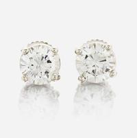 A pair of diamond and white metal earrings