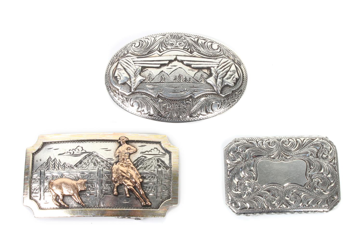 Three Comstock Heritage Sterling Silver Trophy Buckles Height of largest 1 3/4 x width 3 inches.