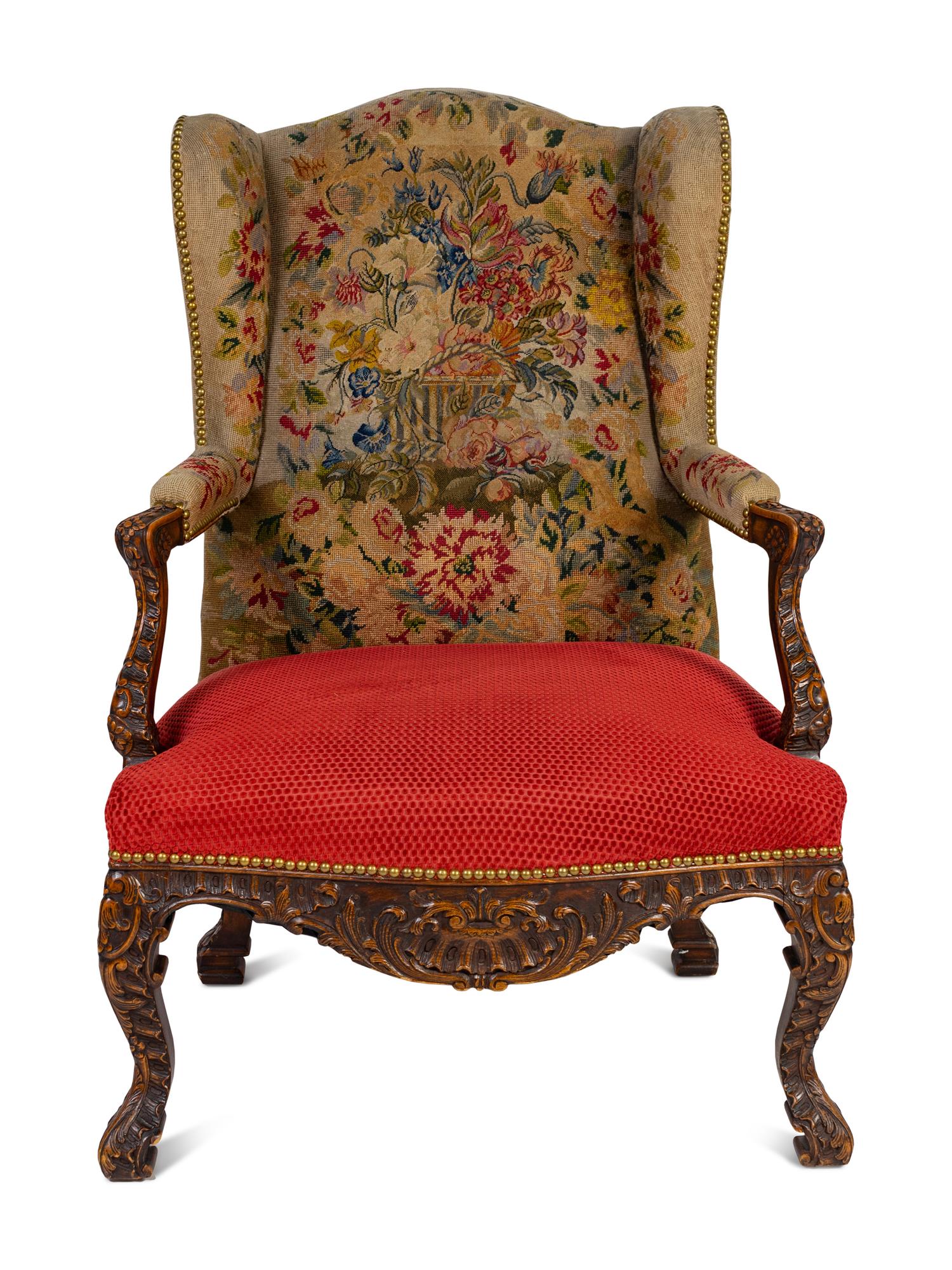 A Régence Style Carved Walnut Bergère à Oreilles with Petit Point Upholstery