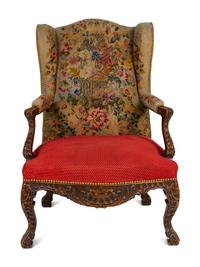 A Régence Style Carved Walnut Bergère à Oreilles with Petit Point Upholstery