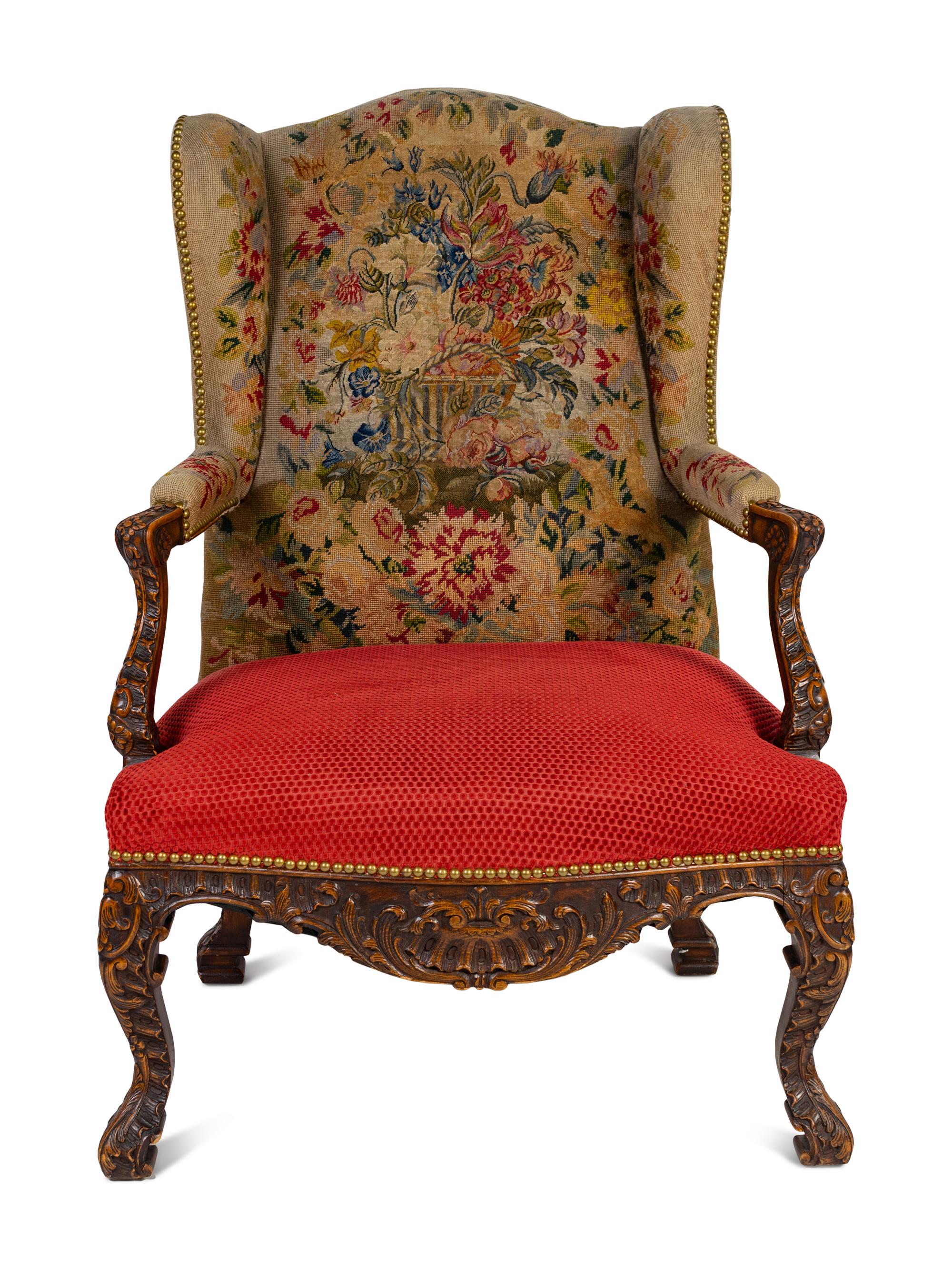 A Régence Style Carved Walnut Bergère à Oreilles with Petit Point Upholstery
