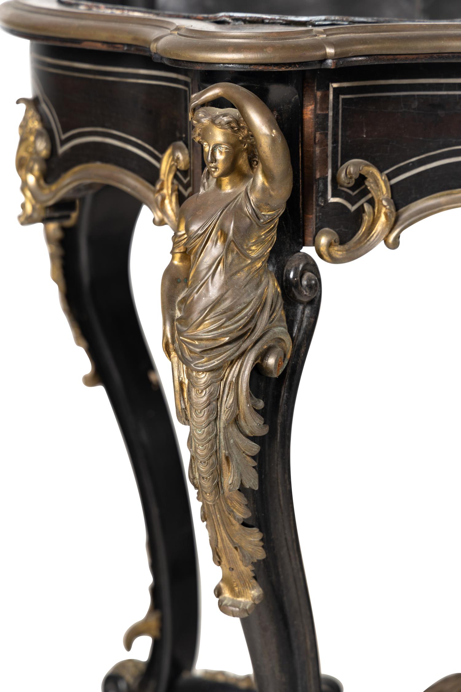 A Napoleon III Gilt Bronze Mounted Ebonized Jardinière Table