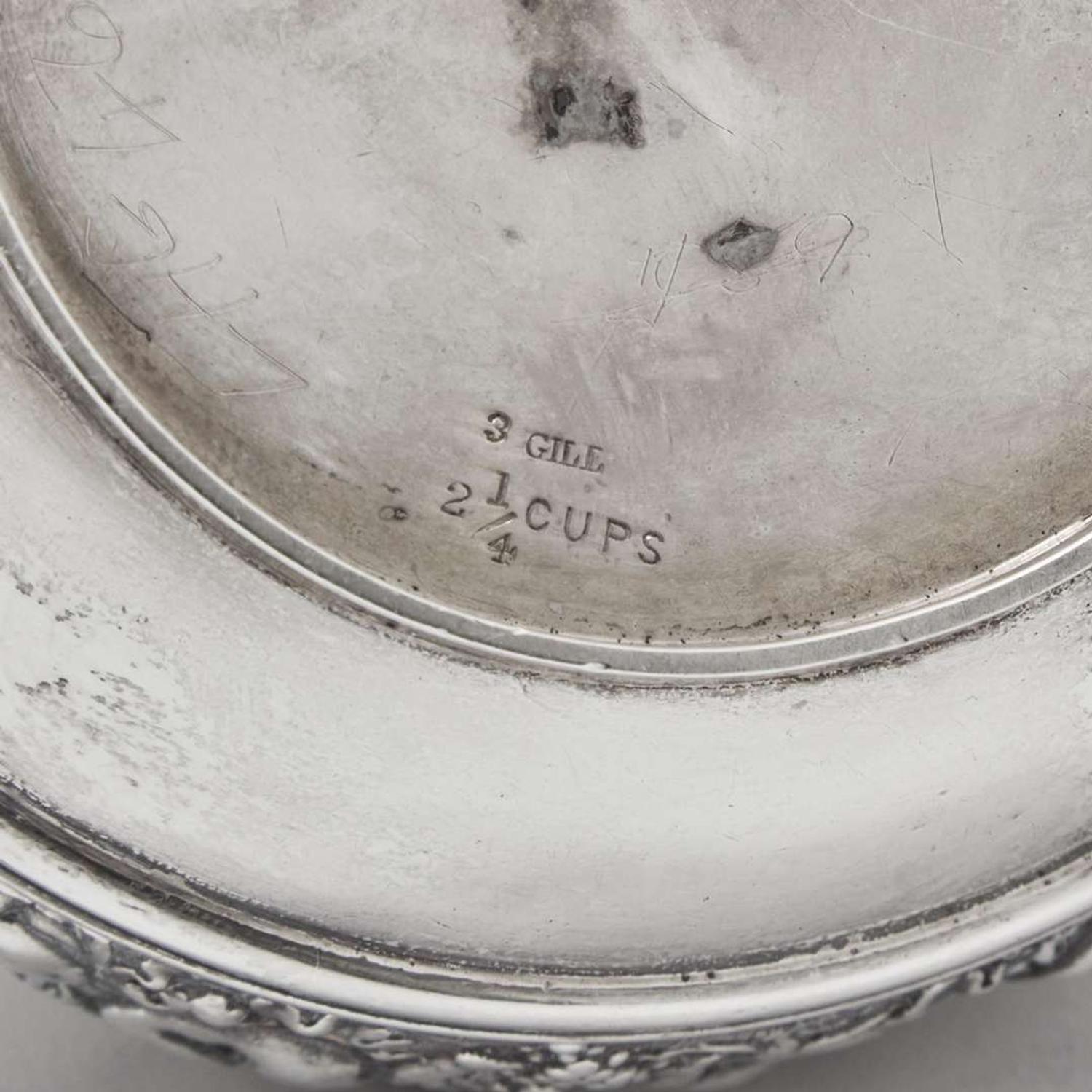 A three-piece sterling silver repoussé tea service Tiffany & Co., New York, NY, 1870-1891
