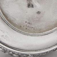 A three-piece sterling silver repoussé tea service Tiffany & Co., New York, NY, 1870-1891