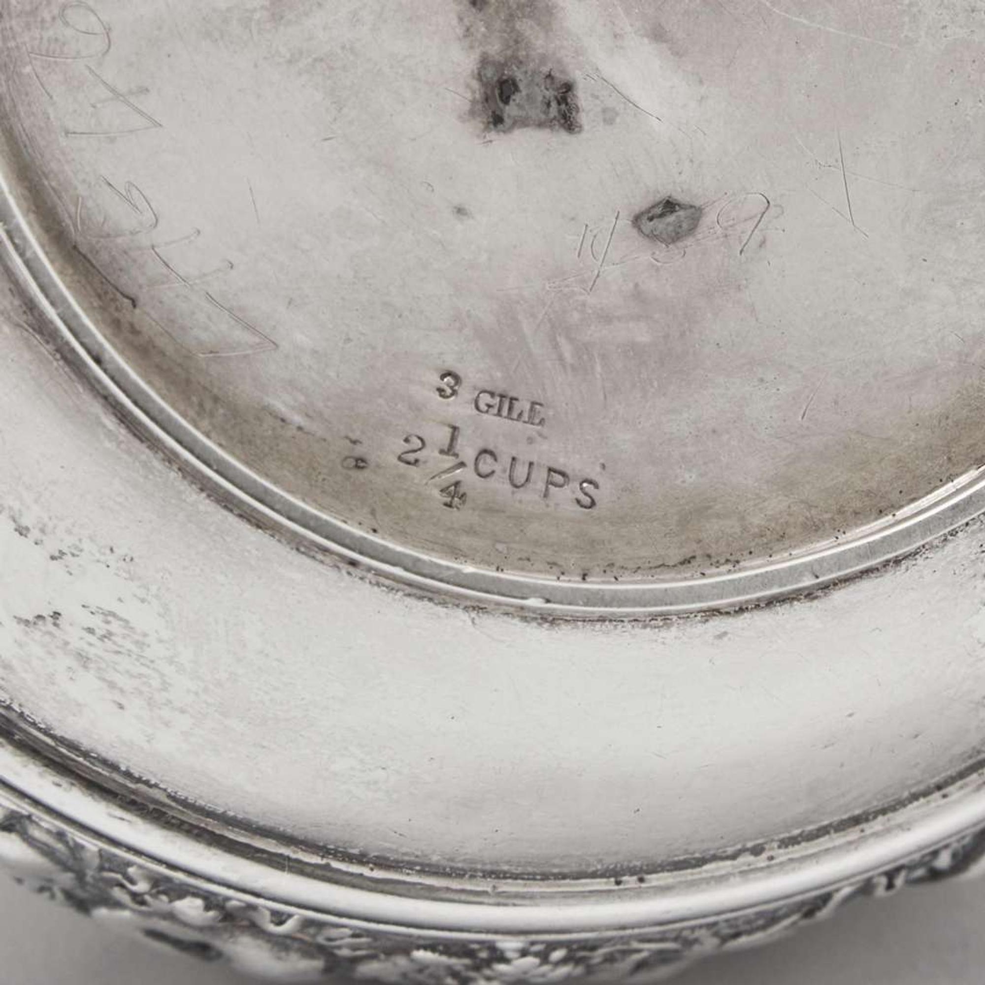 A three-piece sterling silver repoussé tea service Tiffany & Co., New York, NY, 1870-1891