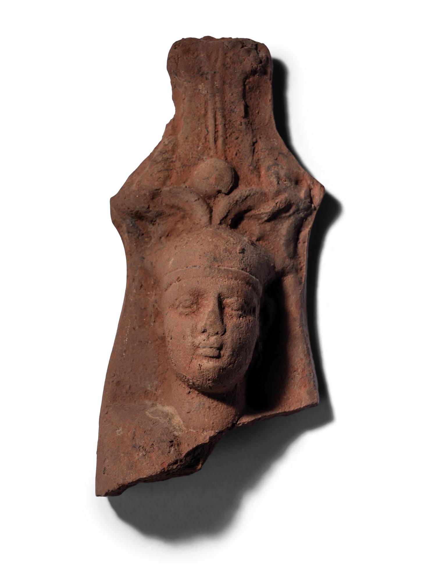 An Egyptian Terracotta Head of the God Osiris
