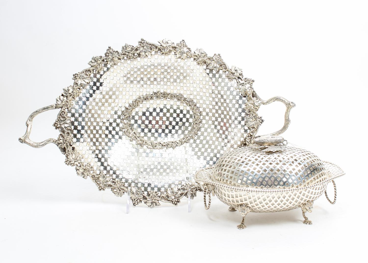 Two Silvered Metal Reticulated Table Articles, , comprising a center basket with pierced body, the rim decorated with grape leaf and cl