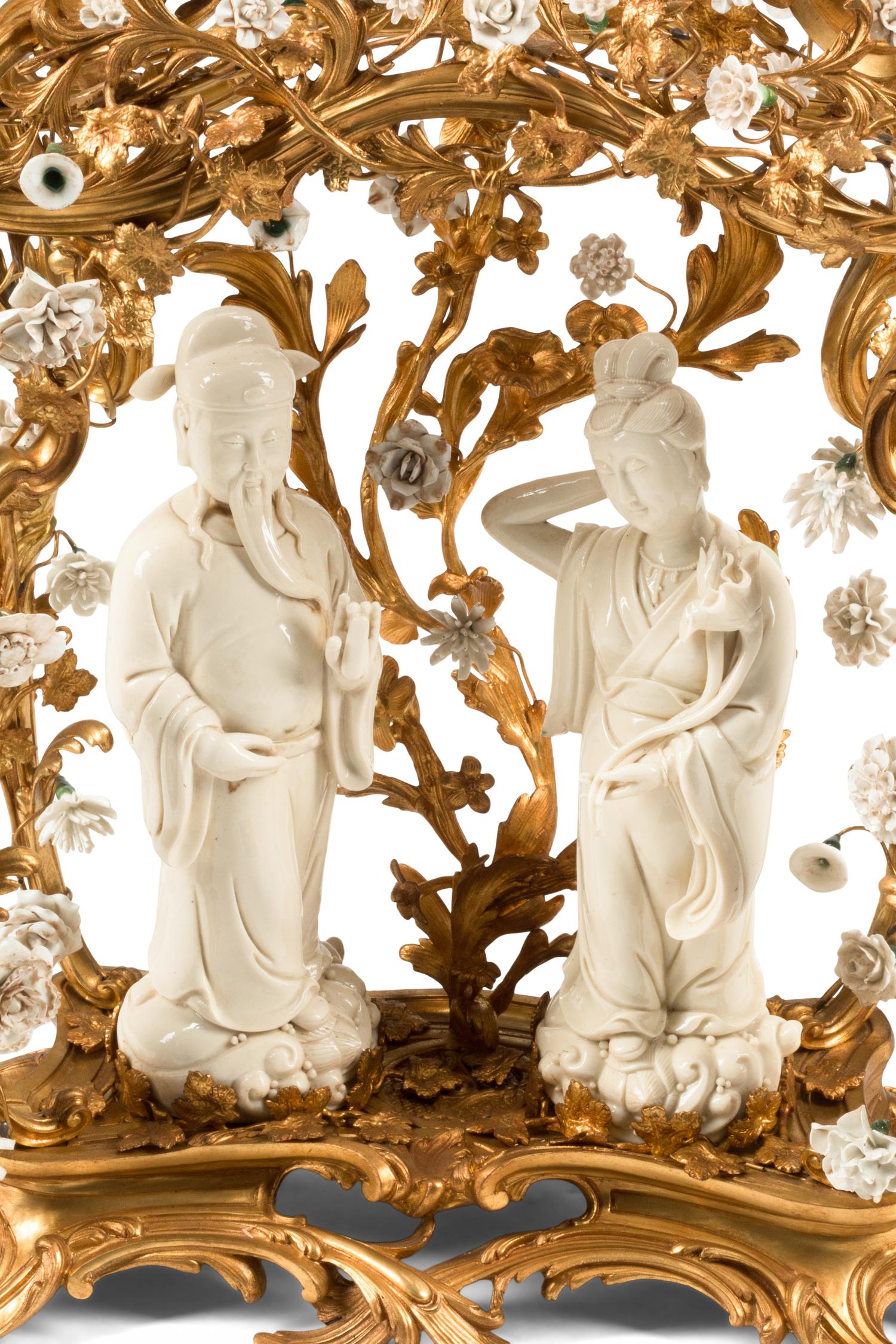 A Louis XV Style Porcelain Mounted Gilt Bronze Clock