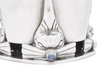 A Set of Six Georg Jensen Silver and Moonstone Mounted Beakers