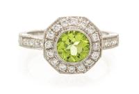 An 18 Karat White Gold, Peridot and Diamond Ring, 2.70 dwts.