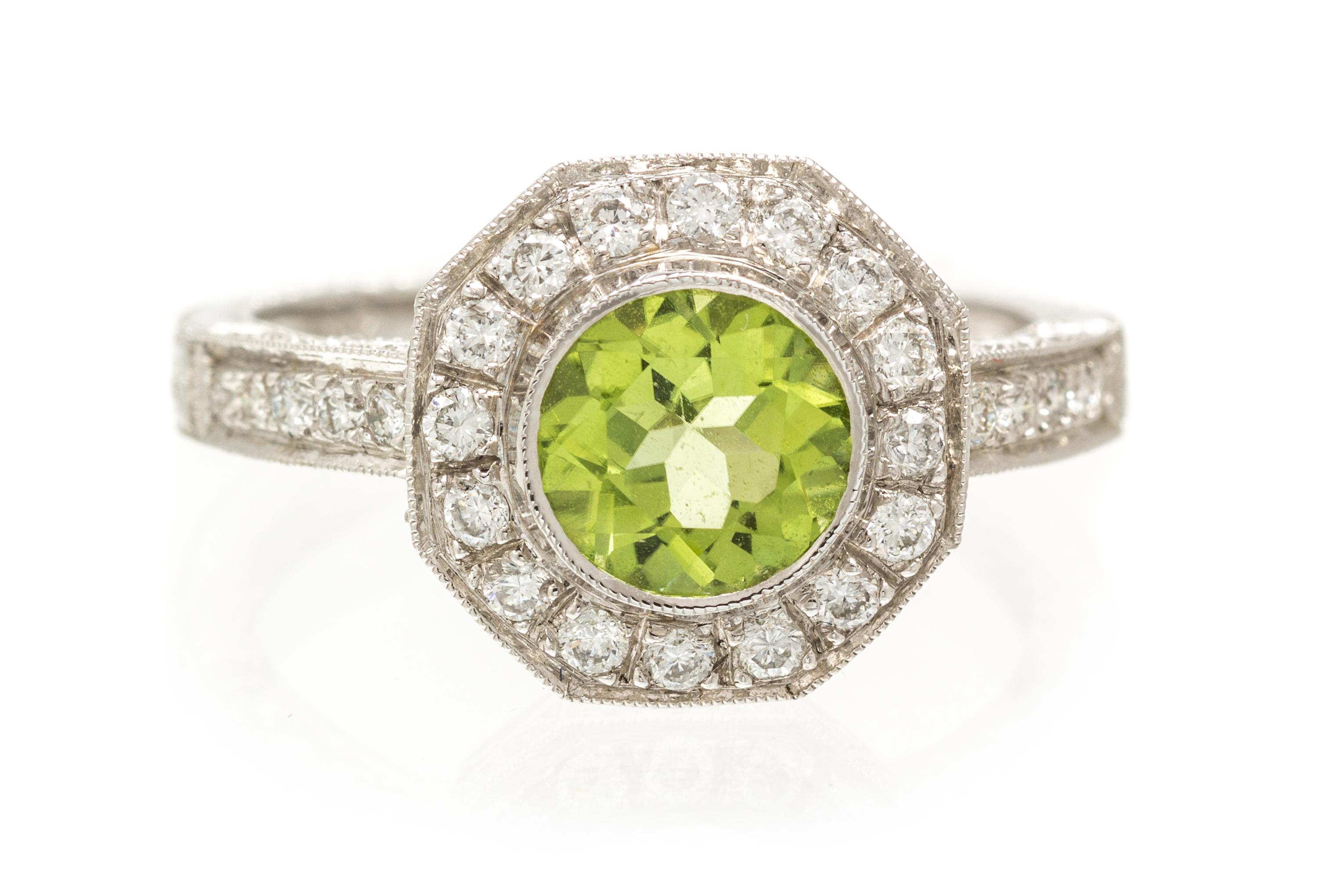 An 18 Karat White Gold, Peridot and Diamond Ring, 2.70 dwts.