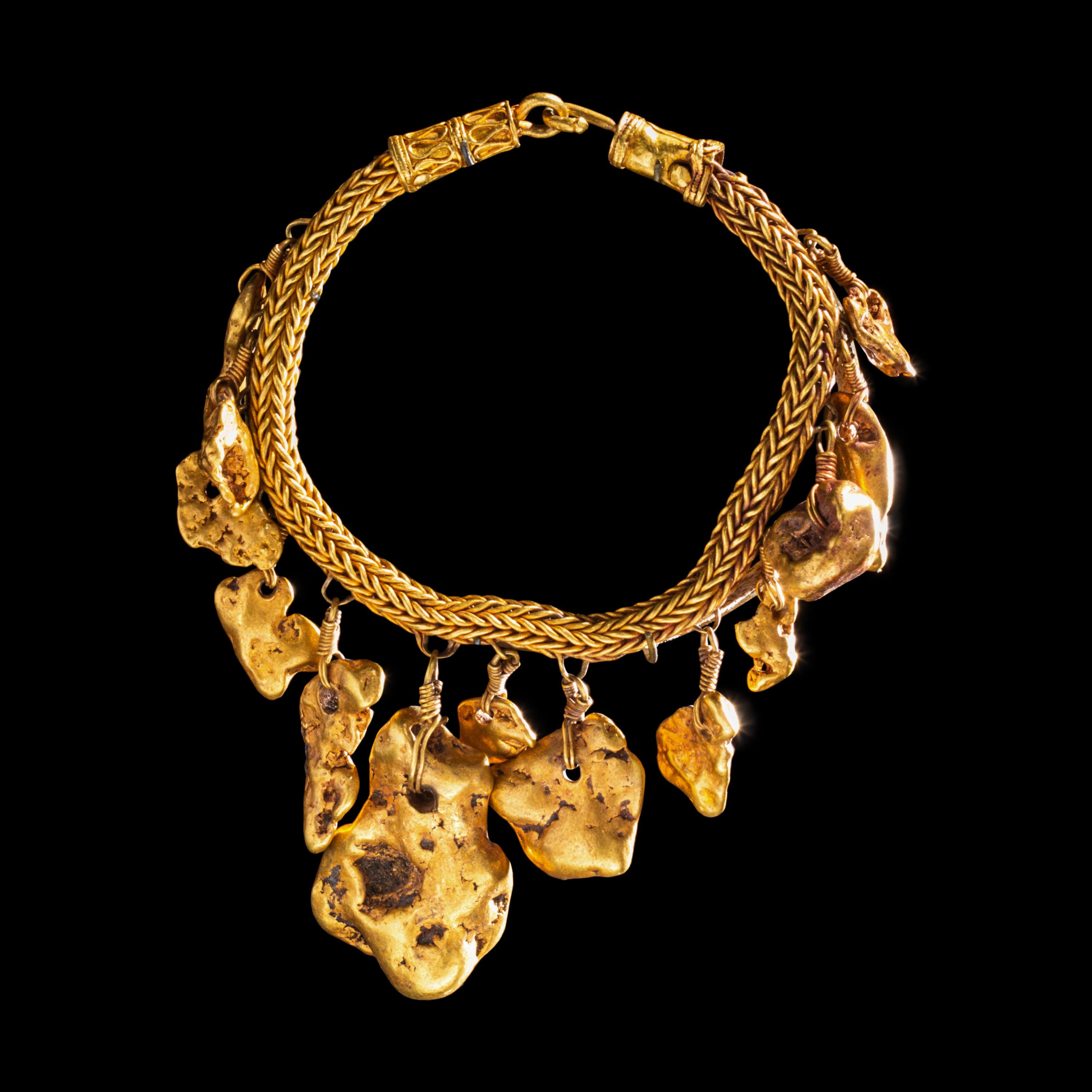 A Greek Gold Bracelet with Nugget Pendants