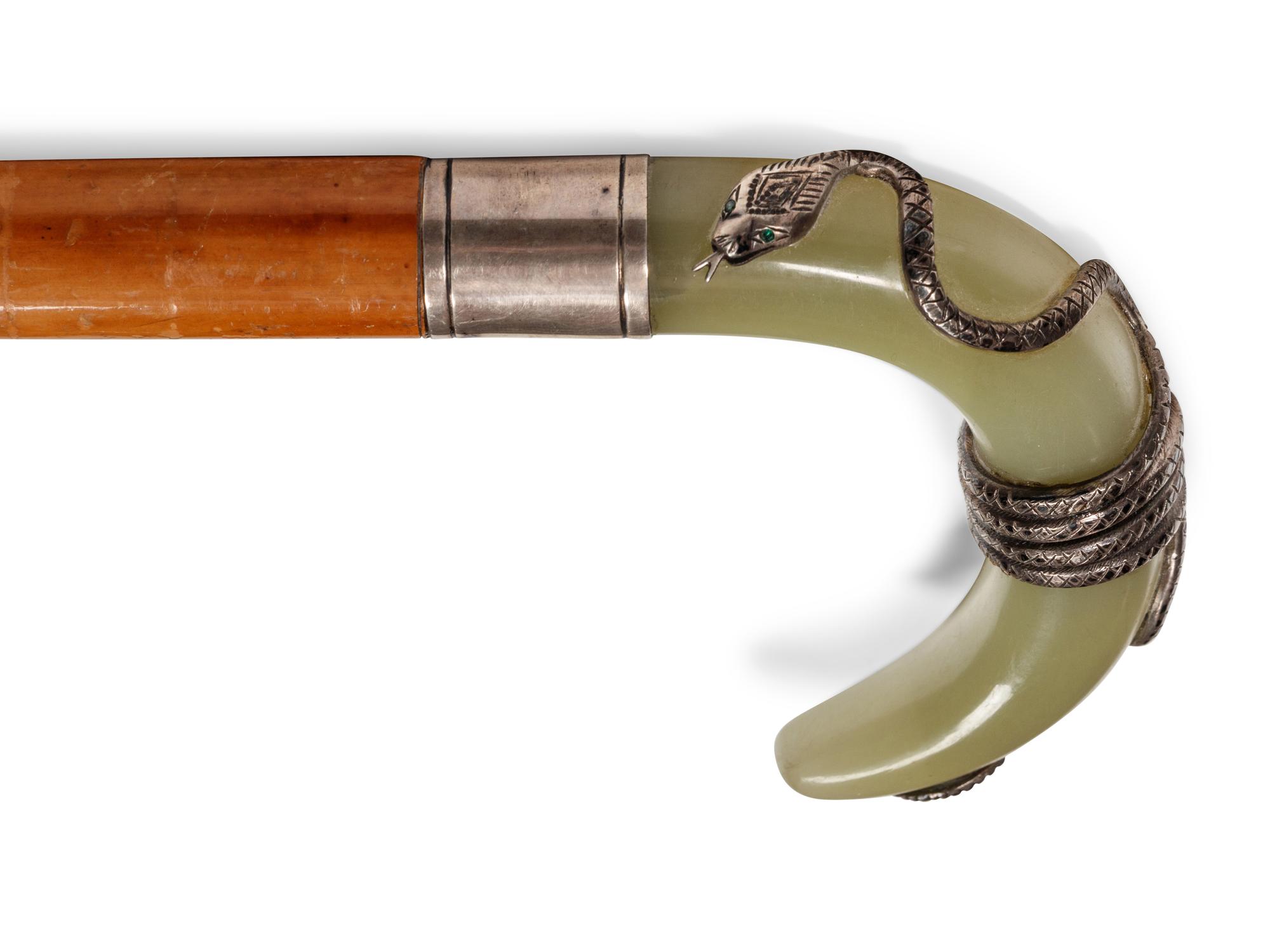 A Carved Onyx and Silver Mounted Malacca Walking Stick