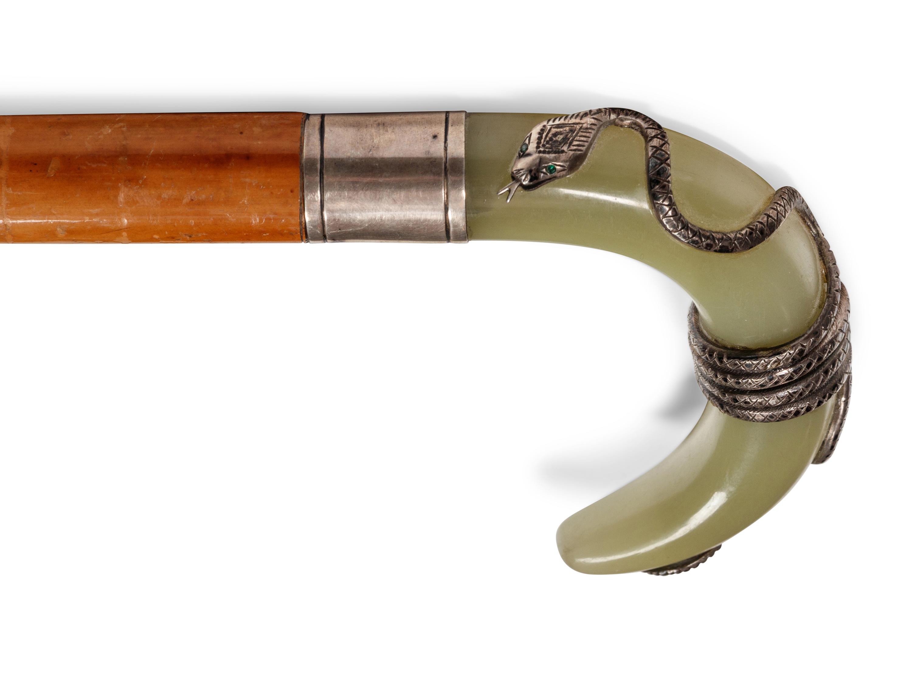 A Carved Onyx and Silver Mounted Malacca Walking Stick