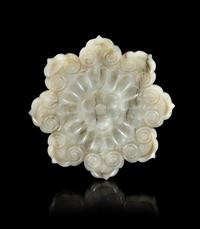 A Grey Jade Mughal Style 'Flower' Plaque Diameter 2 5/8 inches. — 17TH CENTURY