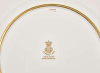 A set of twelve pate-sur-pate gilt and enameled porcelain luncheon plates, Minton, England, retailed by Tiffany & Co., New York, NY, date marks for 1928-1929