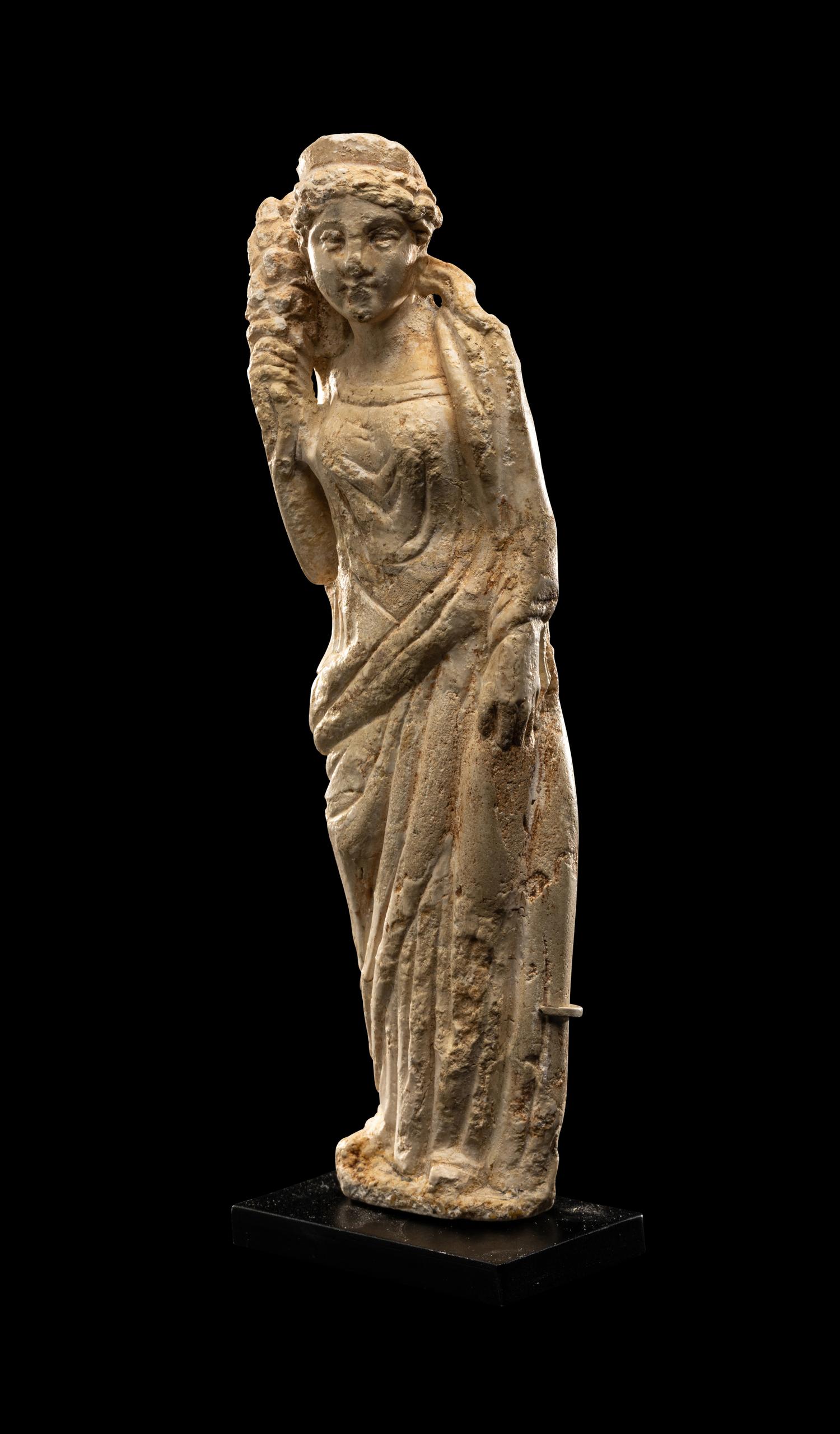 A Roman Stucco Figure of Fortuna
