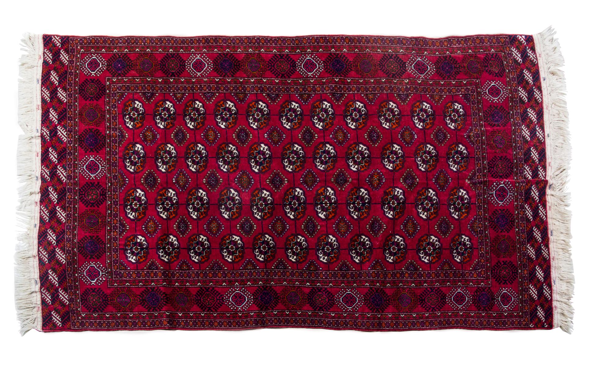 A Russian Bokhara Wool Rug 8 feet 4 inches x 5 feet 1 inch.