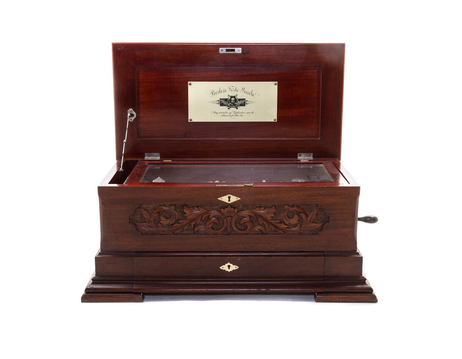 A Peerless Forte-Piccolo Mahogany Cylinder Music Box, Height 10 1/8 x width 25 1/4 x depth 14 1/4 inches.