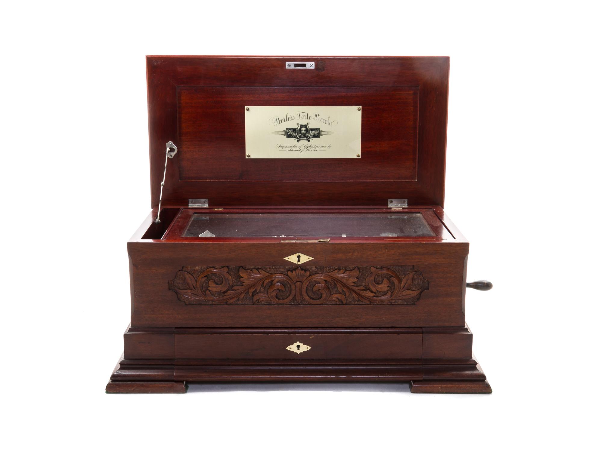 A Peerless Forte-Piccolo Mahogany Cylinder Music Box, Height 10 1/8 x width 25 1/4 x depth 14 1/4 inches.