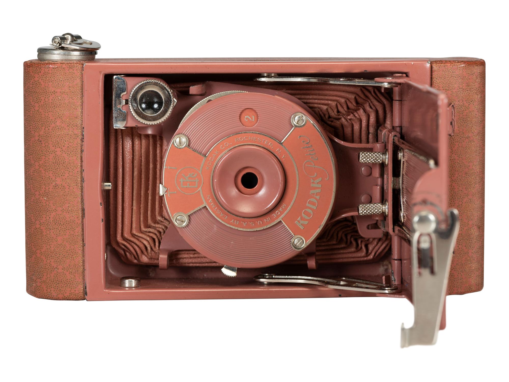 [EARLY PHOTOGRAPHY]. Two Kodak Petite Cameras, one with original vanity case.