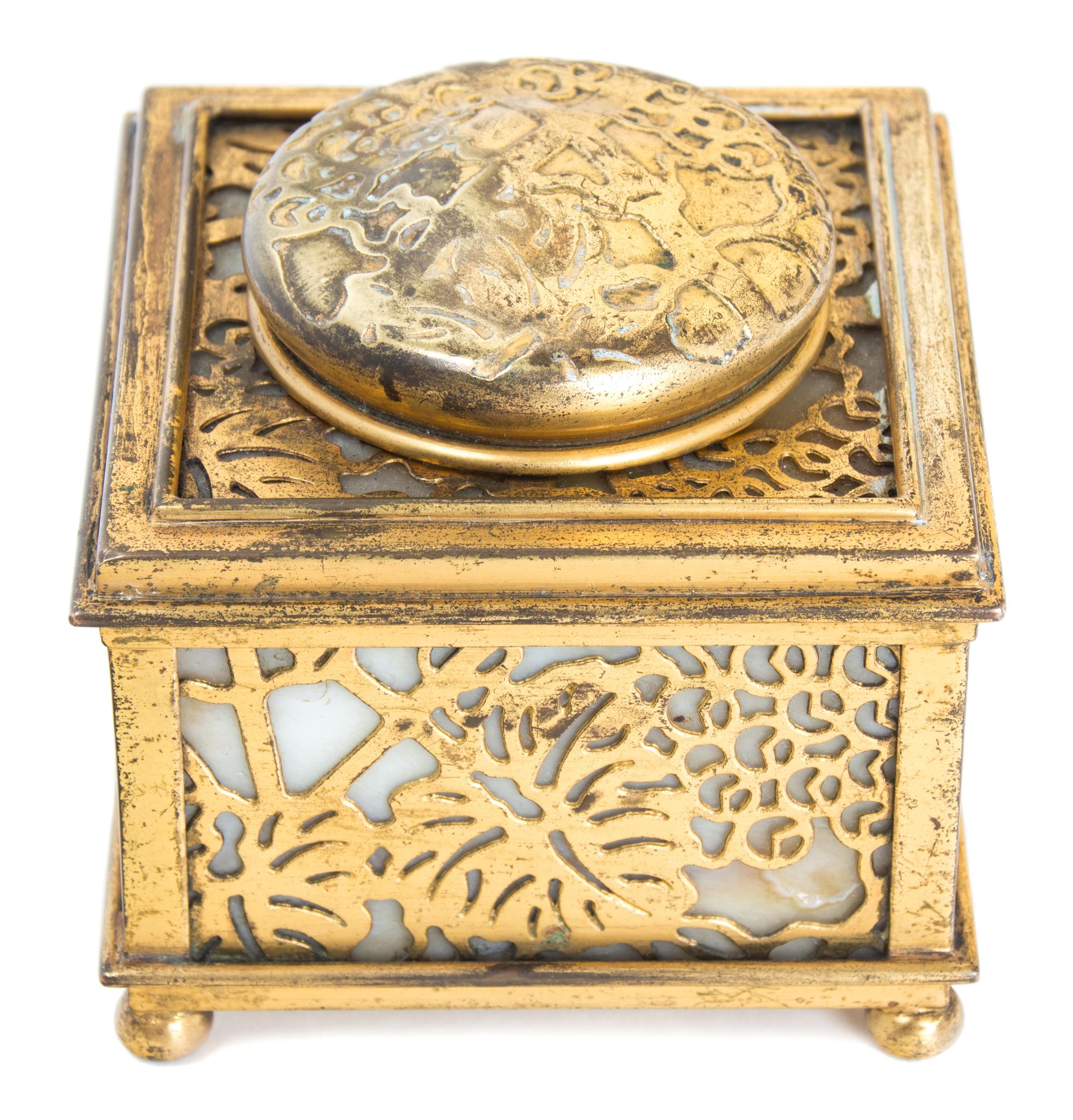 A Tiffany Studios Gilt Bronze and Slag Glass Inkwell Height 2 7/8 x 3 1/8 width inches.