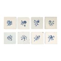 A Collection of Eight Delft Blue and White Floral Decorated Tiles