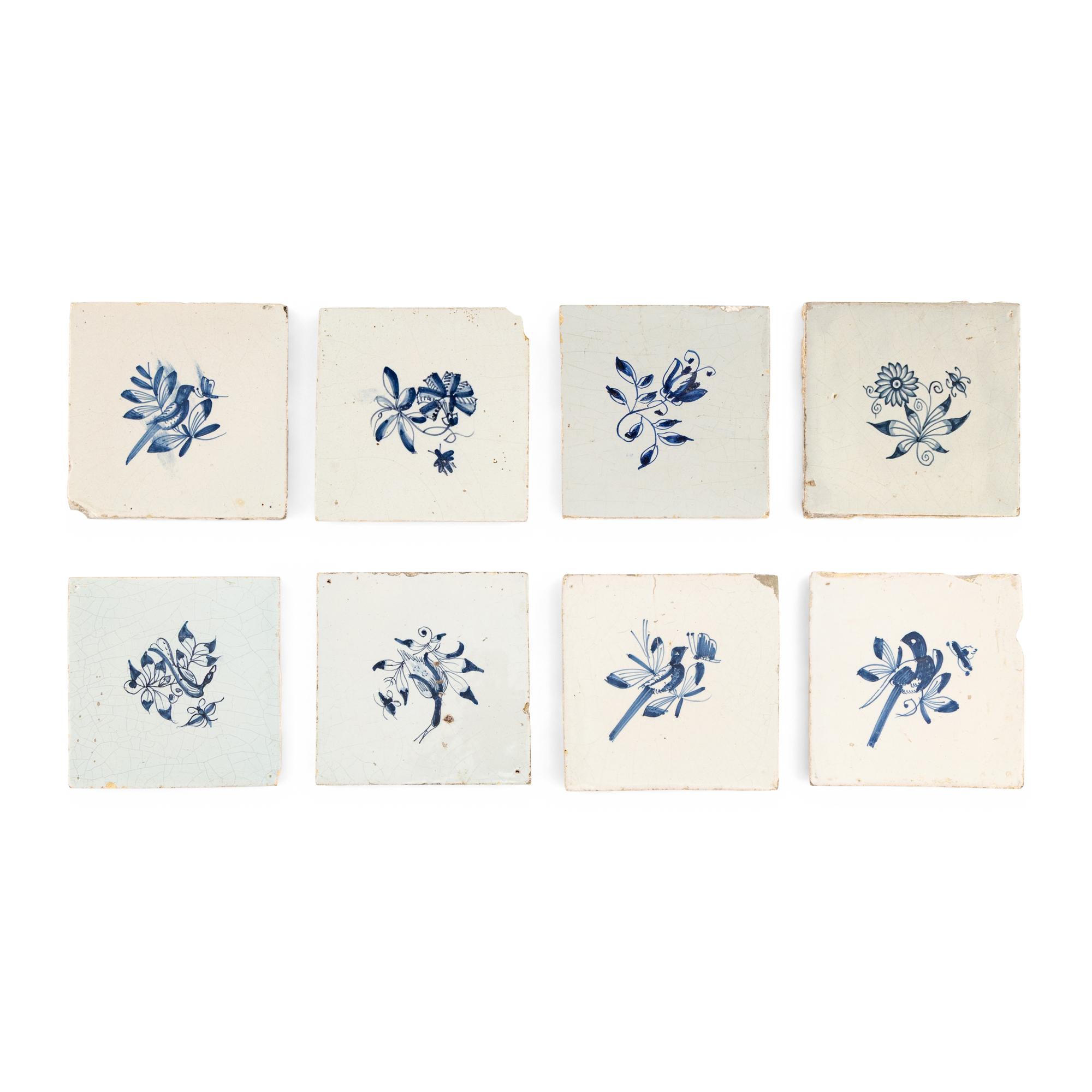 A Collection of Eight Delft Blue and White Floral Decorated Tiles