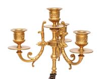 A Pair of Gilt and Patinated Bronze Figural Four-Light Candelabra