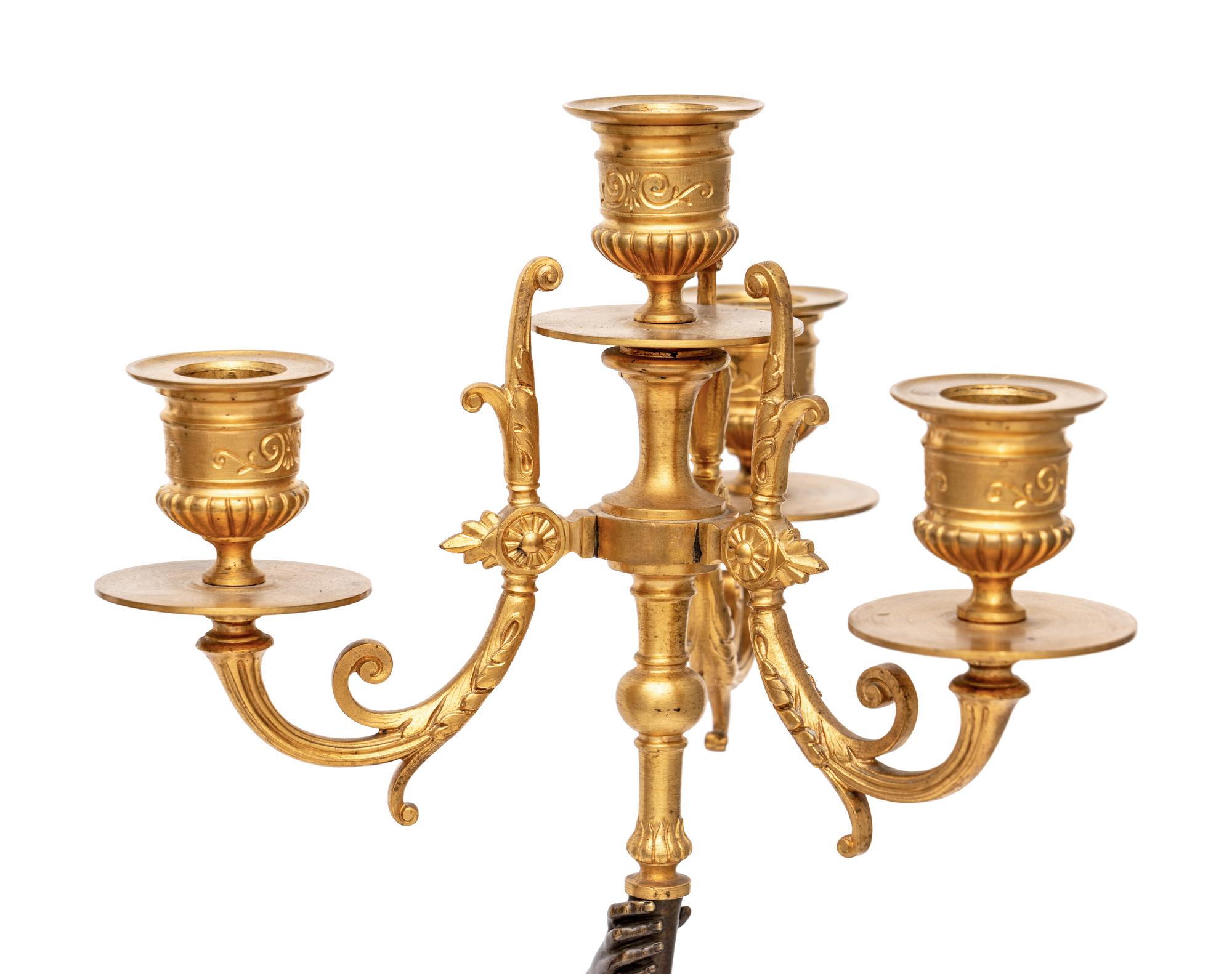 A Pair of Gilt and Patinated Bronze Figural Four-Light Candelabra