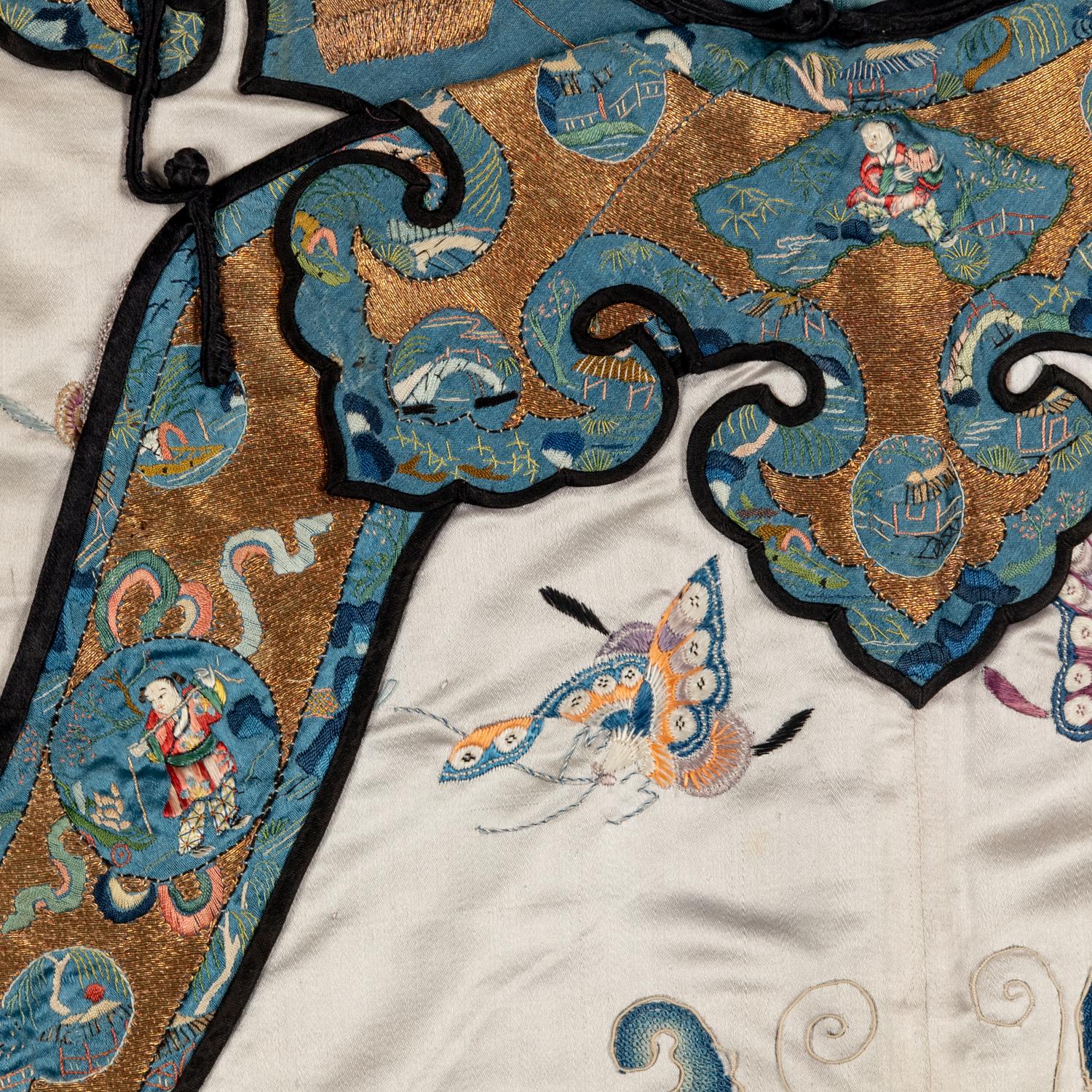 A Chinese Pale Blue Ground Embroidered Silk 'Butterfly' Lady's Informal Robe, Late Qing/Republic Period 晚清/民國 月白緞地百蝶紋女襖