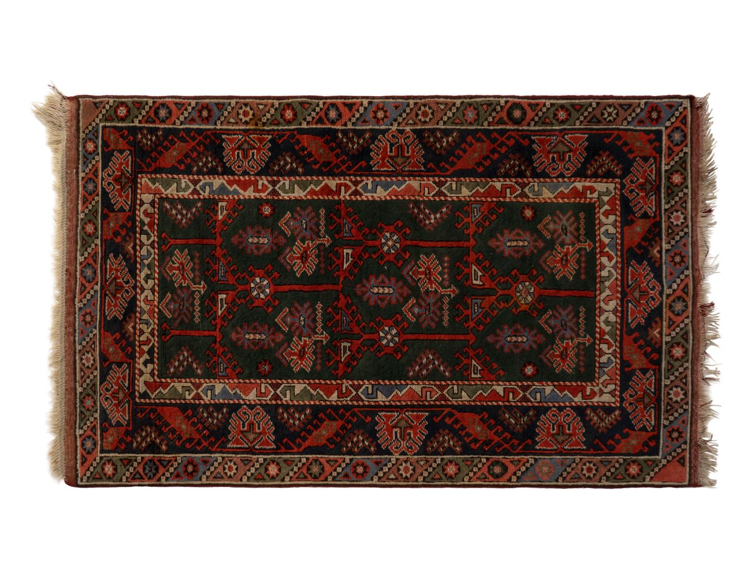 A Caucasian Wool Rug — 20TH CENTURY