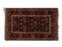A Caucasian Wool Rug — 20TH CENTURY