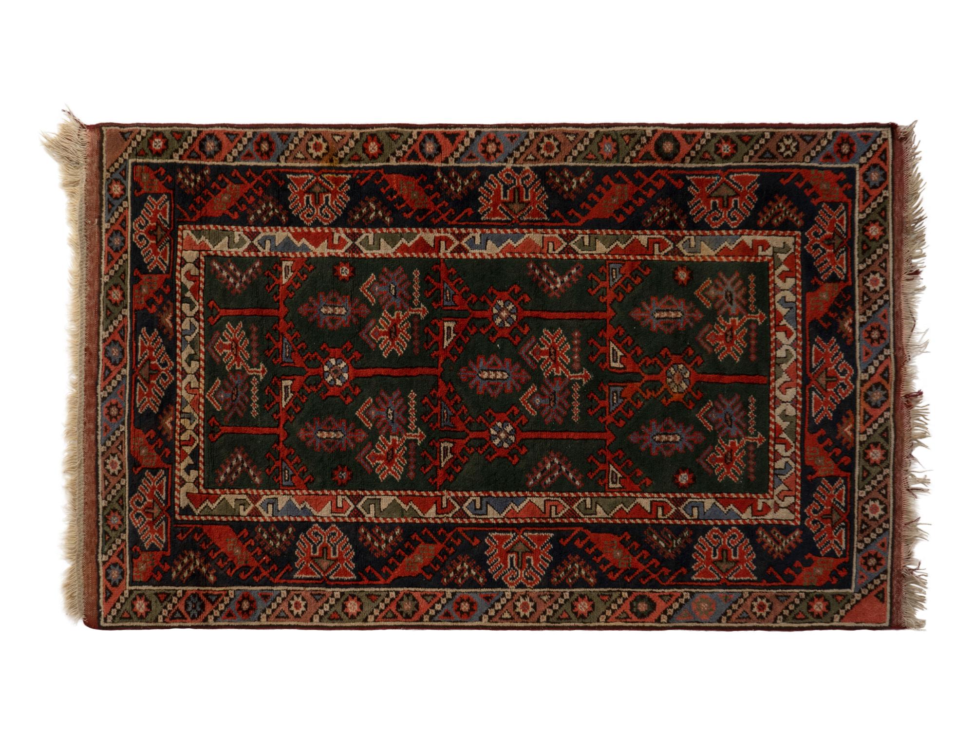 A Caucasian Wool Rug — 20TH CENTURY