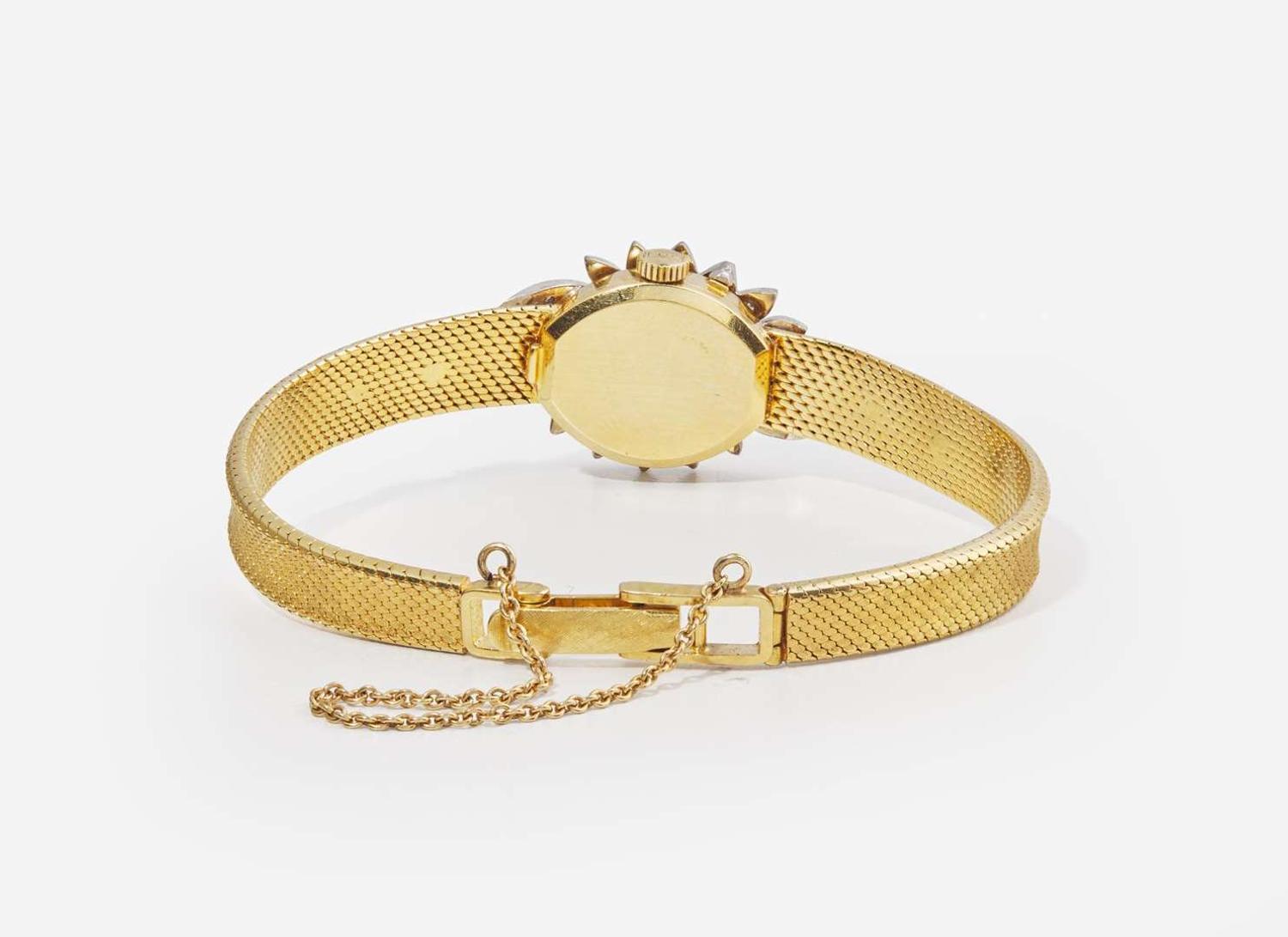 An 18K Yellow Gold and Diamond Hidden Dial Ladies Chopard Watch