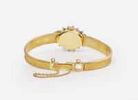 An 18K Yellow Gold and Diamond Hidden Dial Ladies Chopard Watch