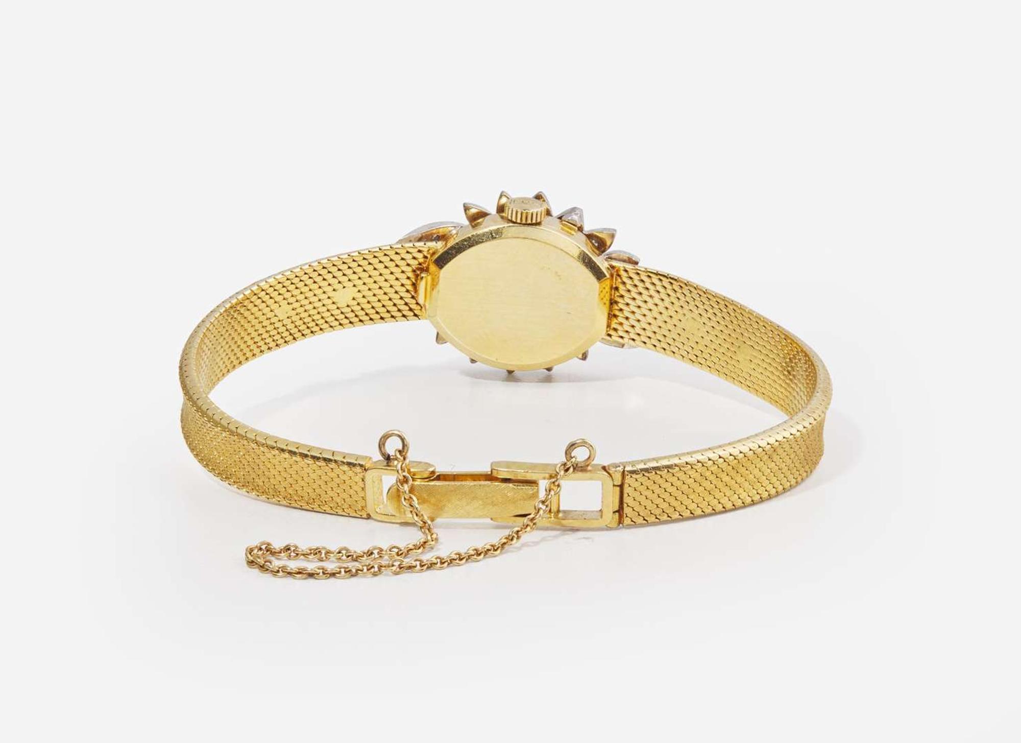 An 18K Yellow Gold and Diamond Hidden Dial Ladies Chopard Watch