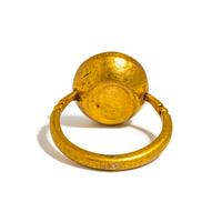 A Roman Gold and Carnelian Finger Ring with the Goddess Minerva Holding Nike