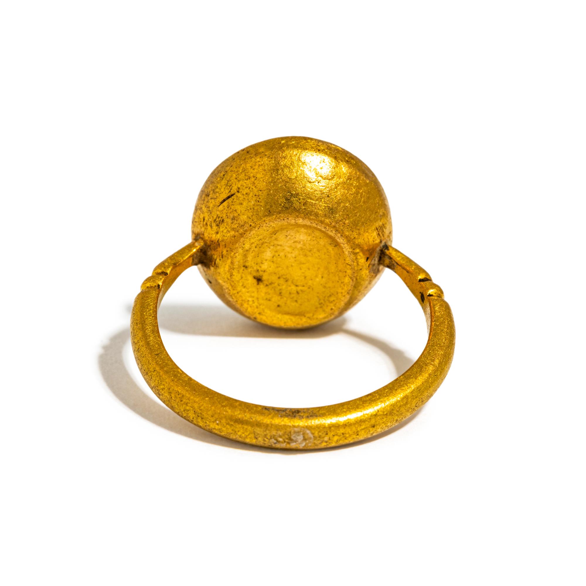 A Roman Gold and Carnelian Finger Ring with the Goddess Minerva Holding Nike