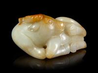 A Russet and White Jade Figure of a Buffalo