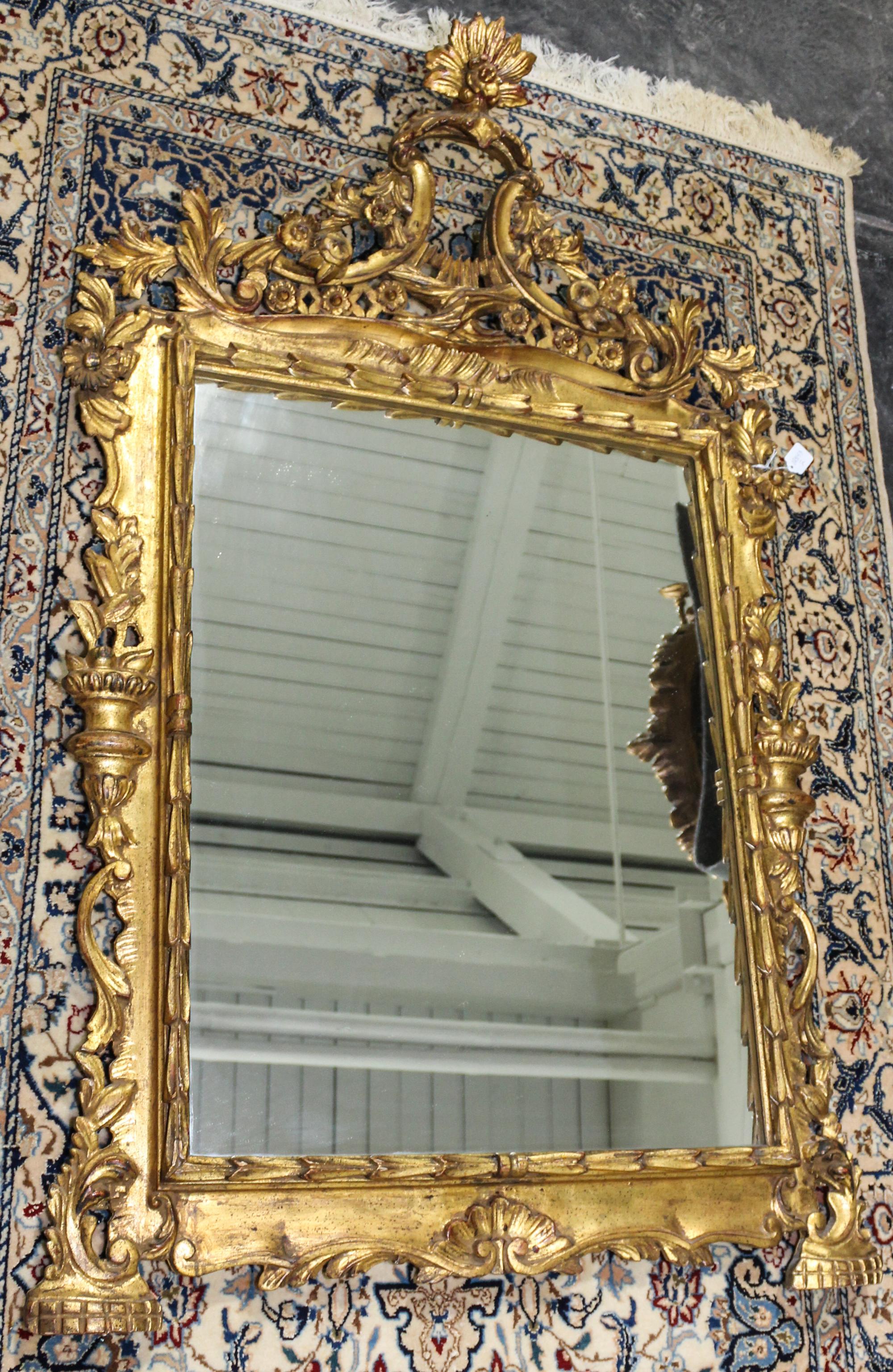 An Italian Giltwood Mirror. Length overall 50 1/2 inches.