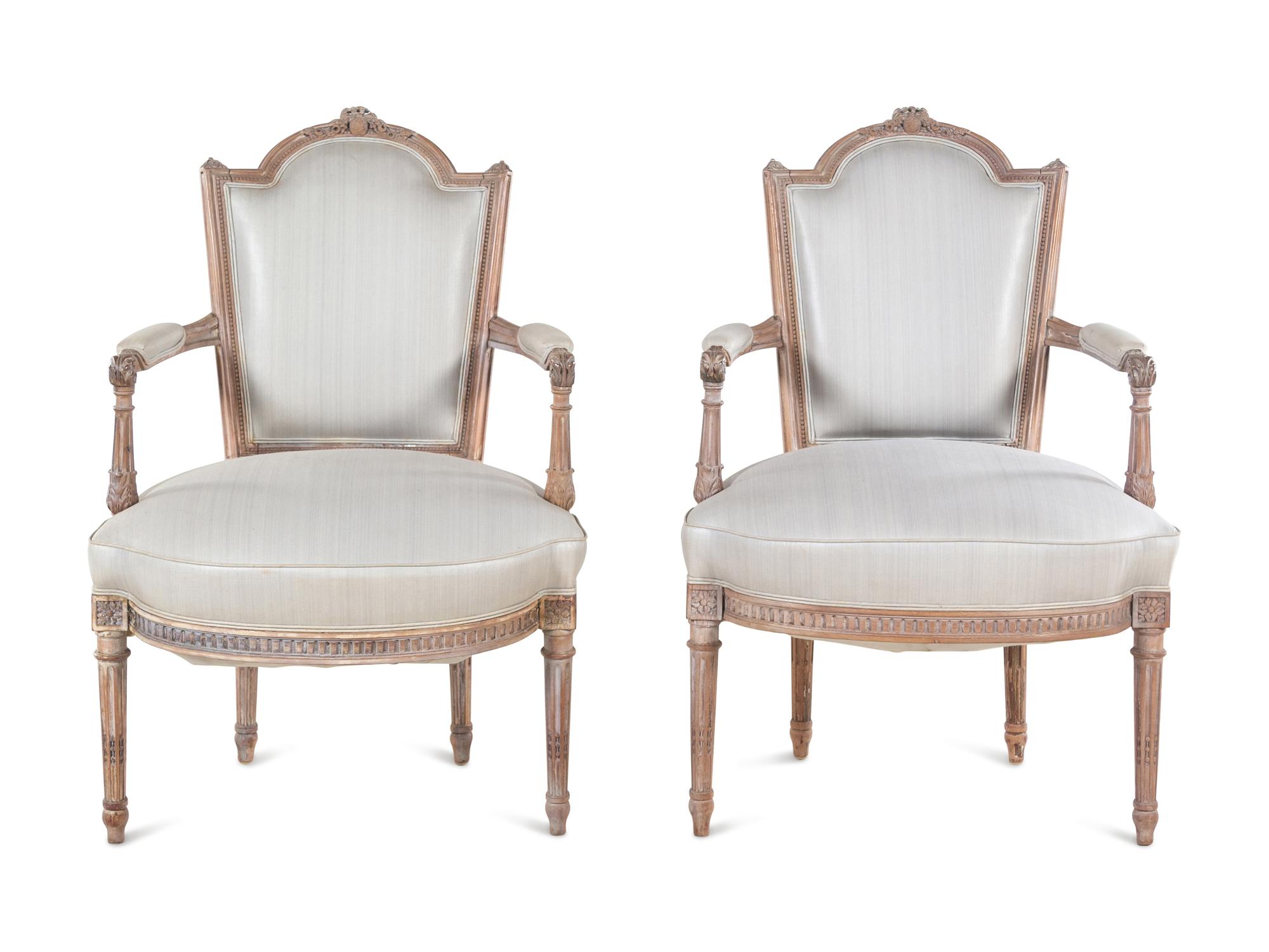A Pair of Louis XVI Limed Beech Fauteuils