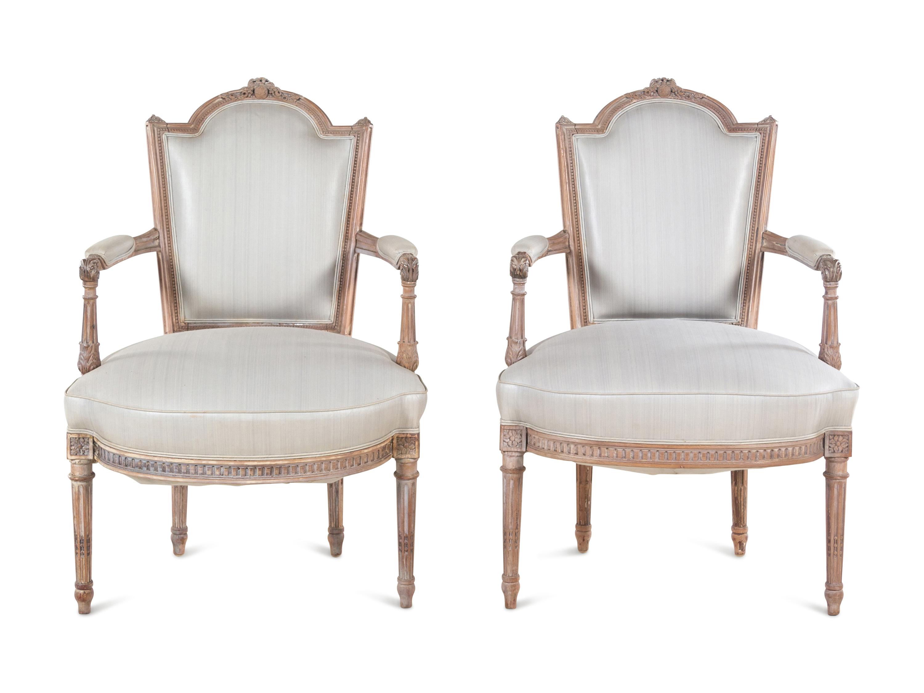 A Pair of Louis XVI Limed Beech Fauteuils